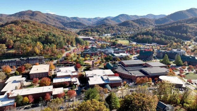 western caroina university aerial push in in the fall with autumn leaves