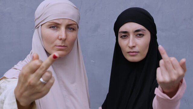 Unique Muslim women show middle finger and advocate for equality in eastern countries. Symbolic gesture emphasize that equality is integral part of their beliefs Concept of fight for equality in world