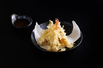 Shrimp tempura Japanese food isolated on a black background