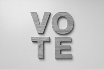 Wooden letters on white background, top view