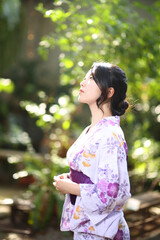 Japanese woman in yukata in coffee shop
