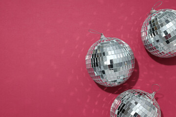 Beautiful disco balls on a red background