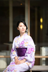 Japanese woman in yukata in coffee shop