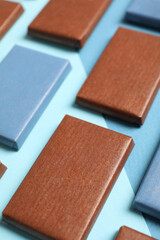 Blue and brown chocolate bars on a blue background