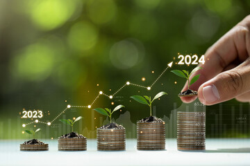 Growing money, finance, and investment 2024. coin stacks are growing with the business arrow of growth. Concept of business growth and investment.profit, development, and success. 2024 New Year.