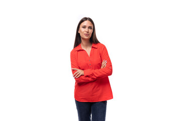 young charming brunette assistant woman dressed in a red shirt on a white background with copy space