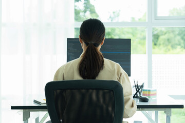 Female IT programmer innovates at office desk.