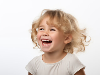 Beautiful little blonde  girl laughing. Full mouth smile. Isolated on white background
