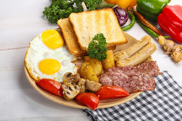 English breakfast with toast, egg and sausages