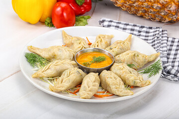 Steamed asian dumpling momo with meat