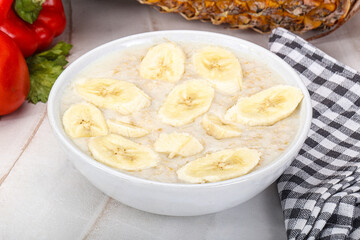Sweet porridge with banana breakfast