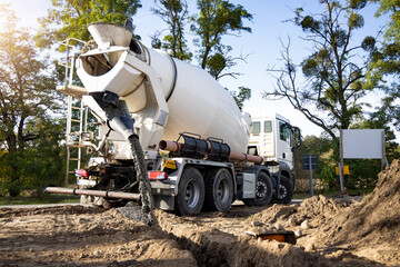 Concrete Mixer Truck Pouring Concrete on a Construction Site