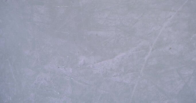 Blue ice in skate scratches, close up view