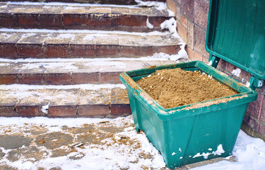Grit bin with sand, treating stair steps with sand. Sand box for Improve traction on snowy and icy...
