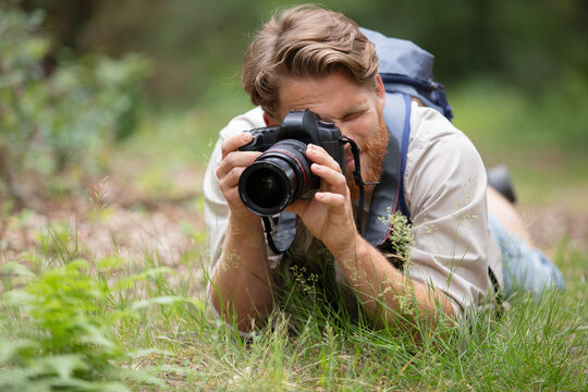 nature photographer at work in a field