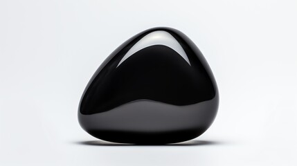 a black stone on a white surface