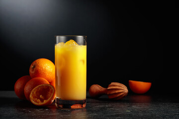Orange juice in a glass with ice.