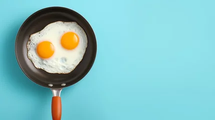 Foto op Plexiglas a frying pan with two eggs © Dumitru