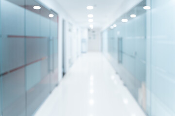 Blurred empty open space corridor. Abstract light bokeh at office interior background for design....