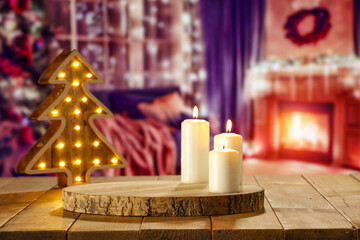 Wooden retro yellow table and blurred background of window sill. Christmas tree and empty space for...