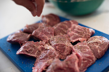 preparing the meat to be cooked