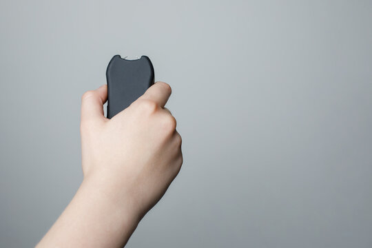 Shock stun gun in female hand. Electric shocker for self defense
