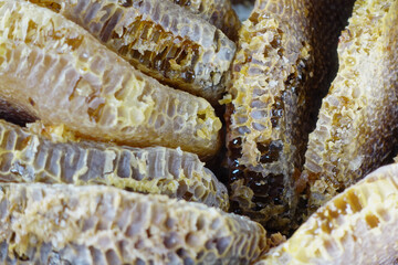 close up of fresh honey with comp in a jar 