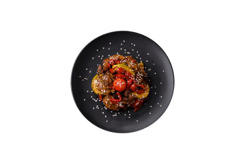Warm salad with veal, tomatoes, peppers, zucchini, sesame, salt, spices and herbs