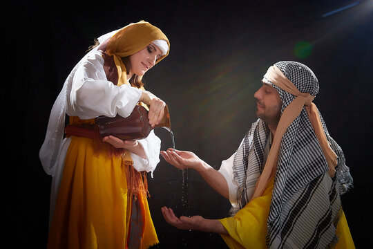 A couple in love or a married couple in stylized Eastern clothing from Israel, Palestine, Iran, Pakistan together. A tender photo session in the style of the Middle East and the Bible