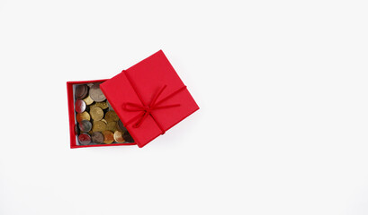 A coins in the gift box. Isolated with white background.