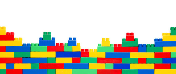 Kid's Wonderland: Constructing a World of Fun and Development. Banner. Wall from Colorful plastic brick blocks. Education, children's creativity