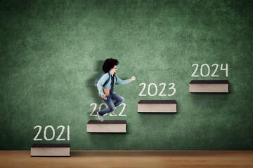 Picture of female student running on the stairs toward number 2024