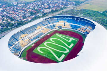 Aerial view of football field with number 2024