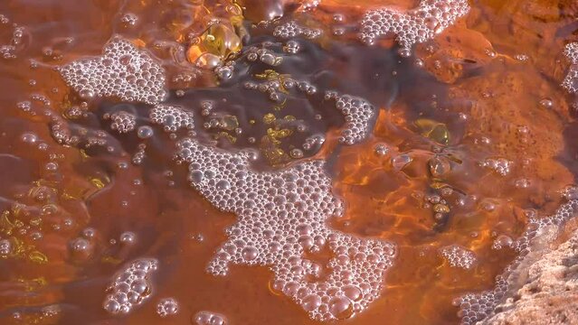 Dallol Sulfur springs and pools. The Sulphur springs create the unearthly colourful and beautiful landscape. Bubbling natural spring of mineral sparkling water.