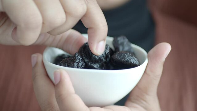 women eating Healthy Natural Dried Plums, prunes 