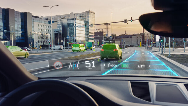 Futuristic Autonomous Self-Driving Car Moving Through City, Head-up Display Showing Infographics: Speed, Distance, Navigation. Road Scanning. Driver Seat POV / First Person View FPV
