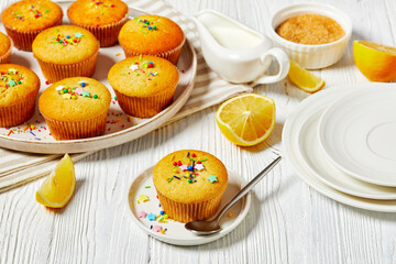 sweet lemon muffins on a plate, top view, close-up