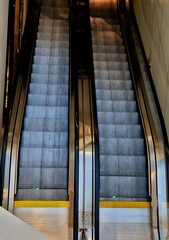 escalator and travelator service and adjustment. lubrication and regular review of the operation of the safety switches that stop machine in an emergency. when people fall, metal front view, stripes