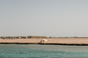 stranded sailboat at the beach near the sea