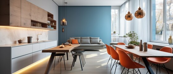 Obraz na płótnie Canvas Interior of modern kitchen with blue walls, wooden floor, white cupboards and dining table with orange chairs. Modern Studio Apartment.