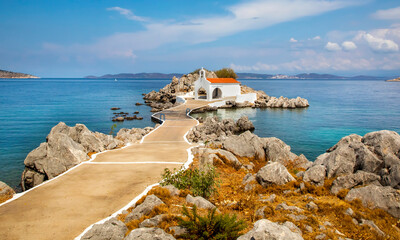 Authentic traditional Greek islands- unspoiled Chios, little church in the sea over the rocks Agios...