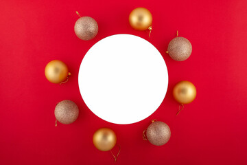 Elegant New Year arrangement in opulent hues. Overhead shot of luxurious ornaments, miniature fir...