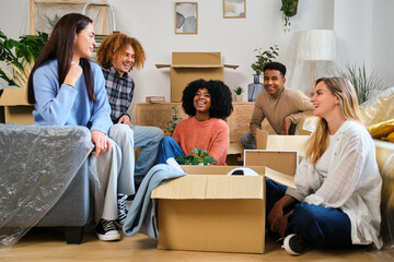 Group of students moving in a student residence at the university. New apartment relocation.
