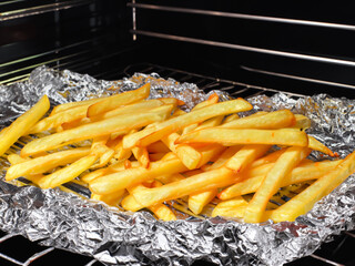 close up french fries in foil