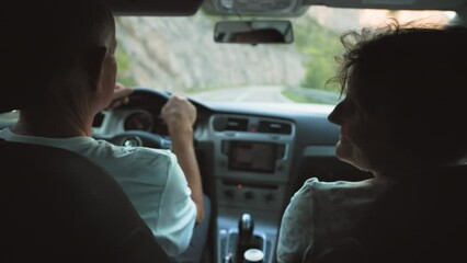 entertainment in retirement, happy elderly male and female pensioners are enjoying themselves in a car on vacation on the road on warm day