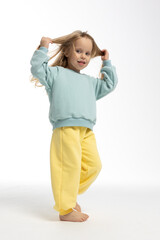 Portrait of beautiful cute little toddler girl. Child with funny face. Pretty smile kid in studio on white background. High quality photo