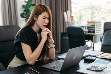 young asian businesswoman cover her face after stressed with Financial problem, credit card debt. - obrazy, fototapety, plakaty