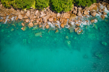  Bird eye drone of turquoise transparent water, corals and rocks, Mahe Seychelles 2