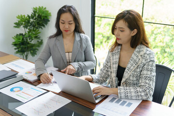 Businesswoman Accountant analyzing investment charts Invoice and pressing calculator buttons over documents. Accounting Bookkeeper Clerk Bank Advisor And Auditor