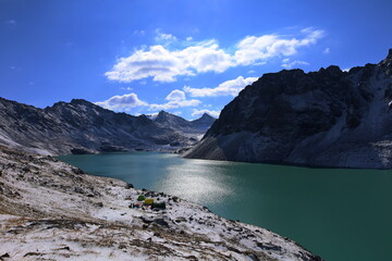 Ala-k&ouml;l mountain lake with fresh snow during summer in Tian Shan mountains, Karakol, Kyrgyzstan